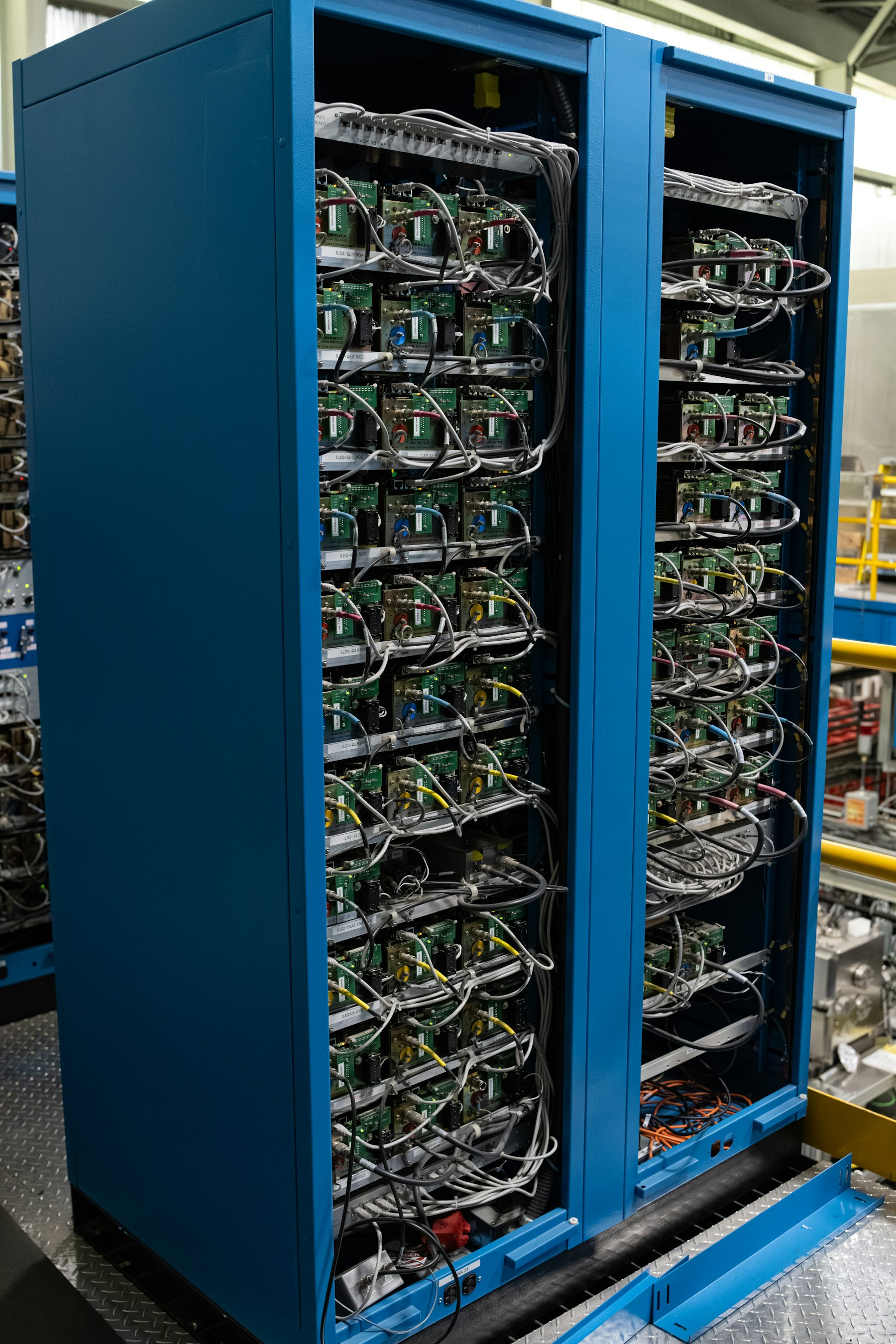 Control system racks with wired electronic components in a lab